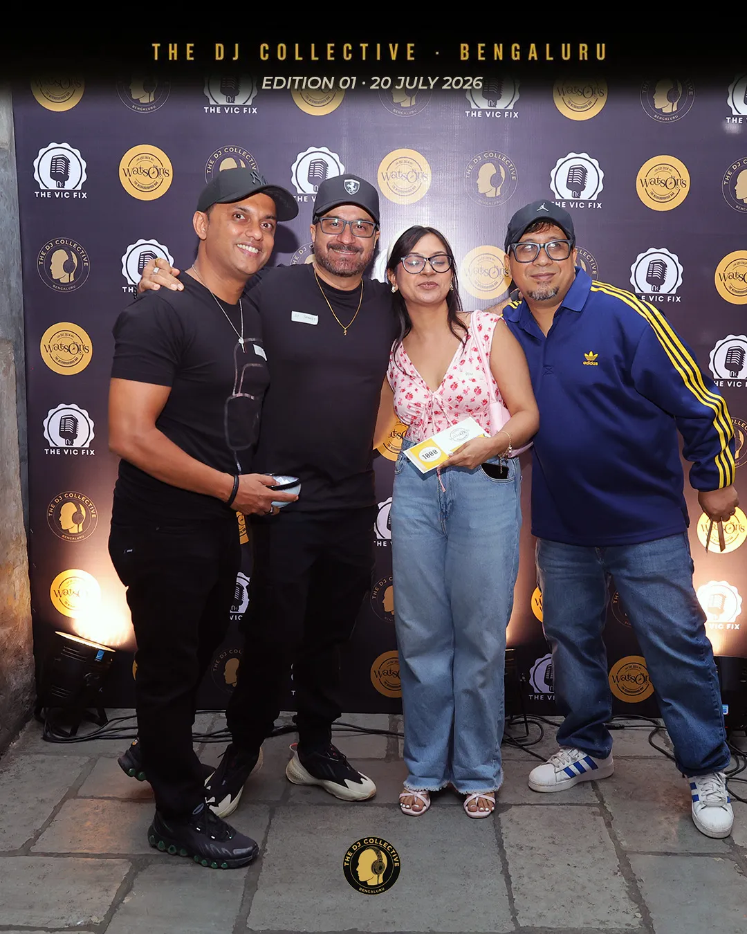 Four DJs posing together for a portrait